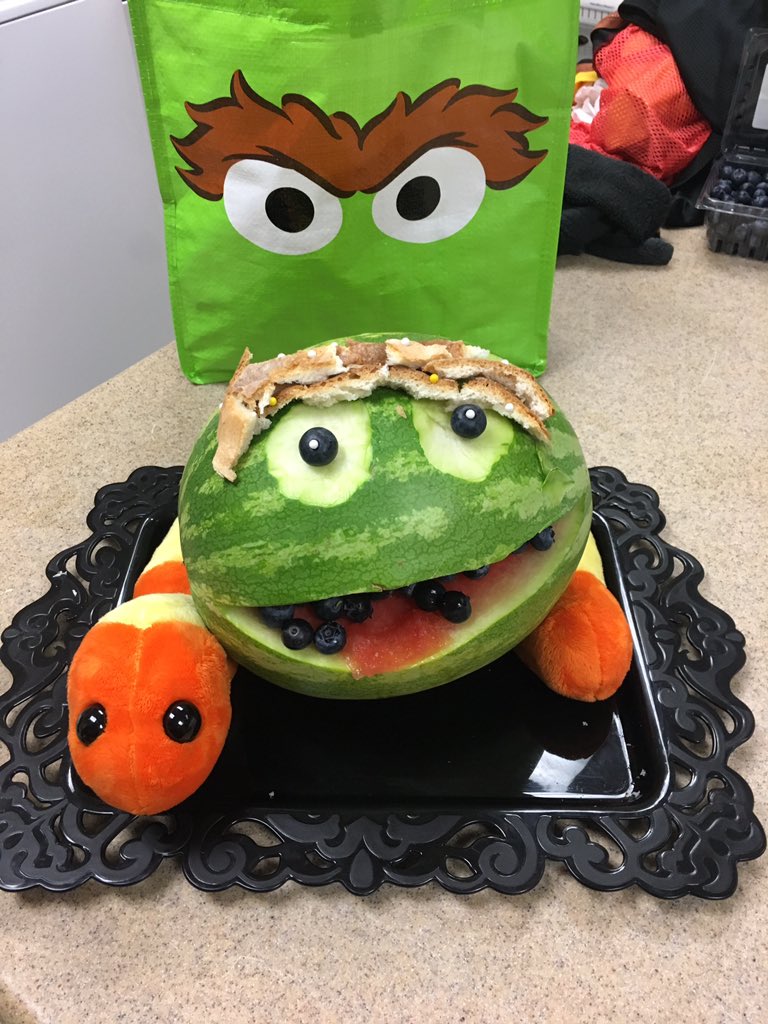 tweetnickm's tweet photo. In honor of Oscar’s birthday, I made an “Oscarmelon.” He is really enjoying the gray skies, the rain, and an otherwise gloomy day.      #BestWorstBirthday #grouchy #SesameStreet50 https://t.co/H5M7tTOcGd