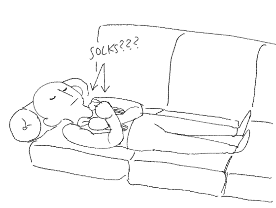 my friend just fell asleep on our couch holding their socks like they were guarding some sacred ancient tomb 