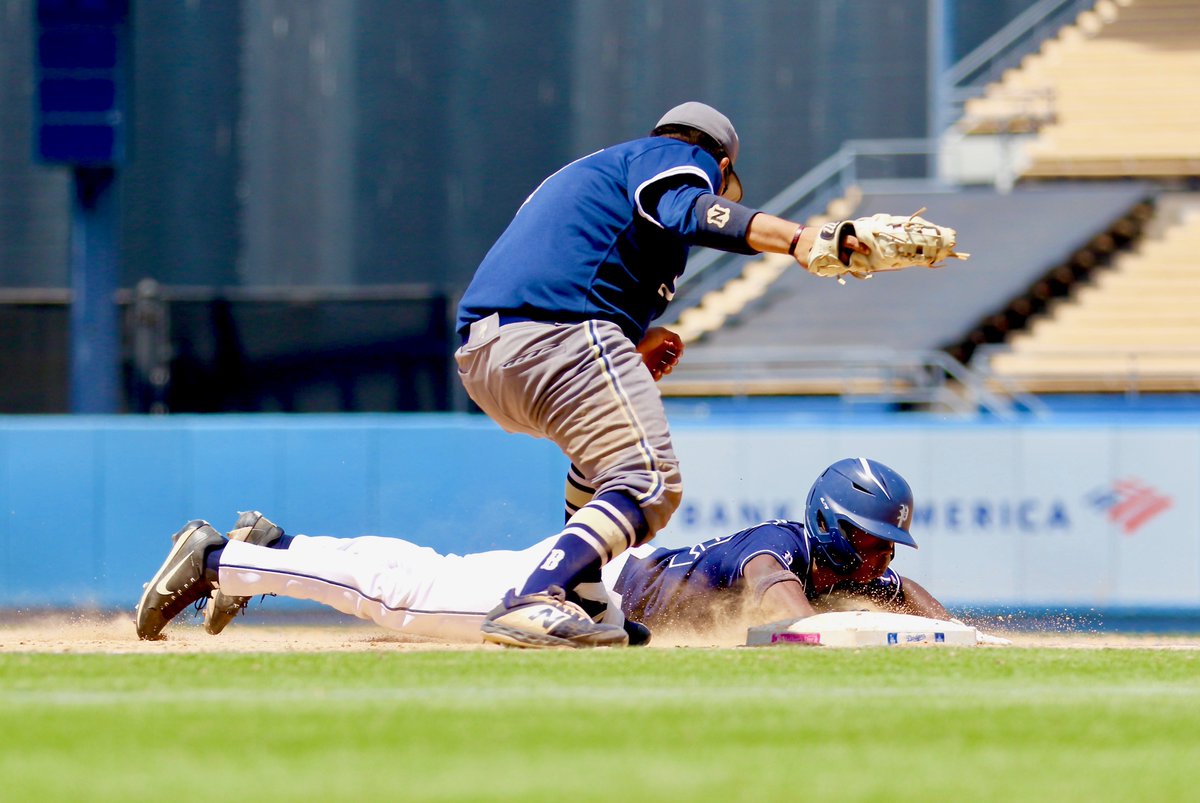 PalisadianPost's tweet photo. Palisades' Kent Johnson dives back to the bag before Birmingham first baseman Erik Rivas can tag him in the fifth inning. The Dolphins loaded the bases but couldn't score. Photo by: Steve Galluzzo

#palihigh #baseball #sports #palipost https://t.co/6gAS3vUiNb