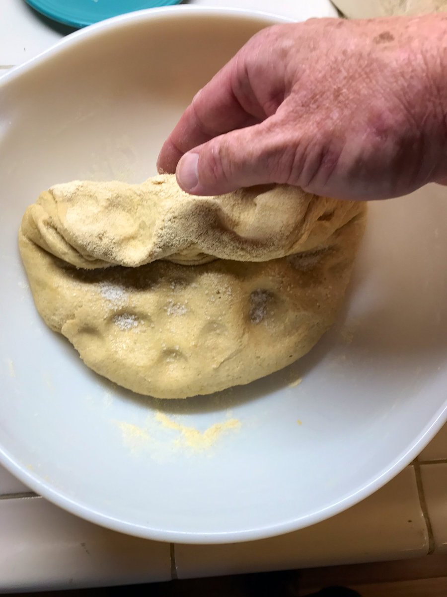 Sprinkle 1/2 (5g) of the salt onto the dough. Now roll it up as shown. You will get a cigar shaped thing.