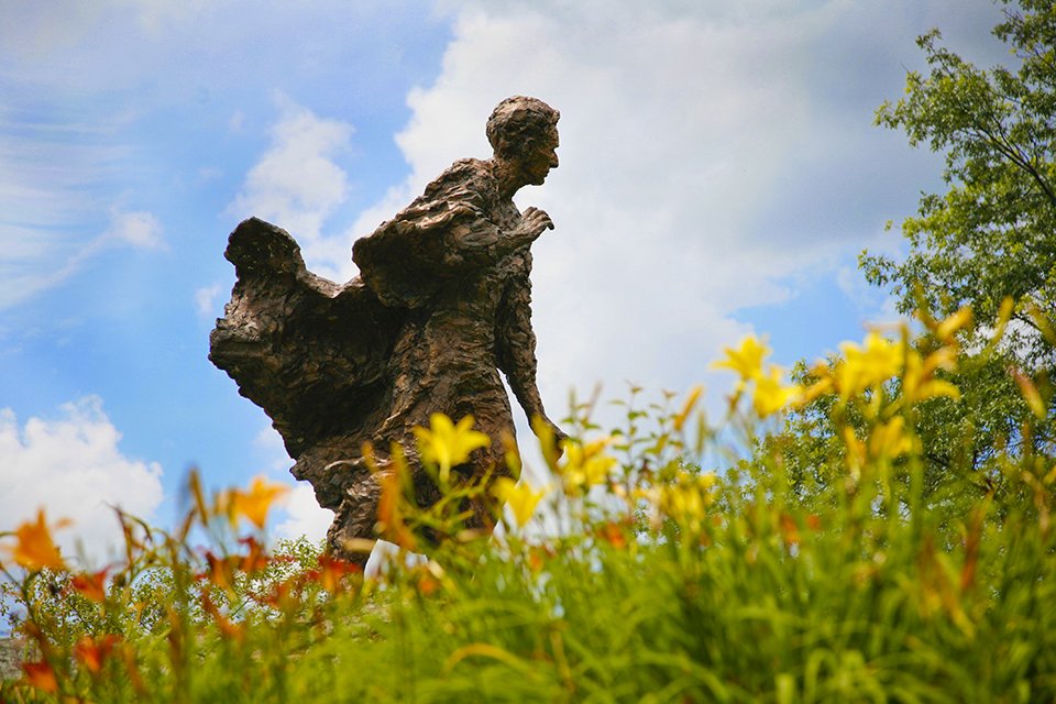 Statue of the Justice Louis Brandeis on the Brandeis campus in summer.