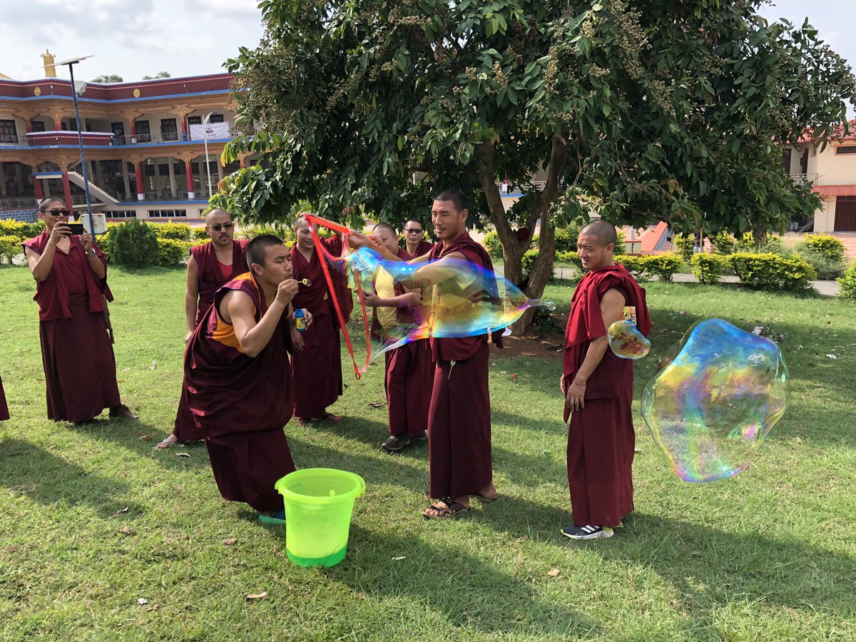 CaitlinHay17's tweet photo. Fun with bubbles! Our monk students learned about thin film interference by blowing bubbles in front of the Sera Mey Science Center. #PhysicsClass #PhysicsEd #Physics #ETSI @judybeck25 https://t.co/zzQoqGBylk