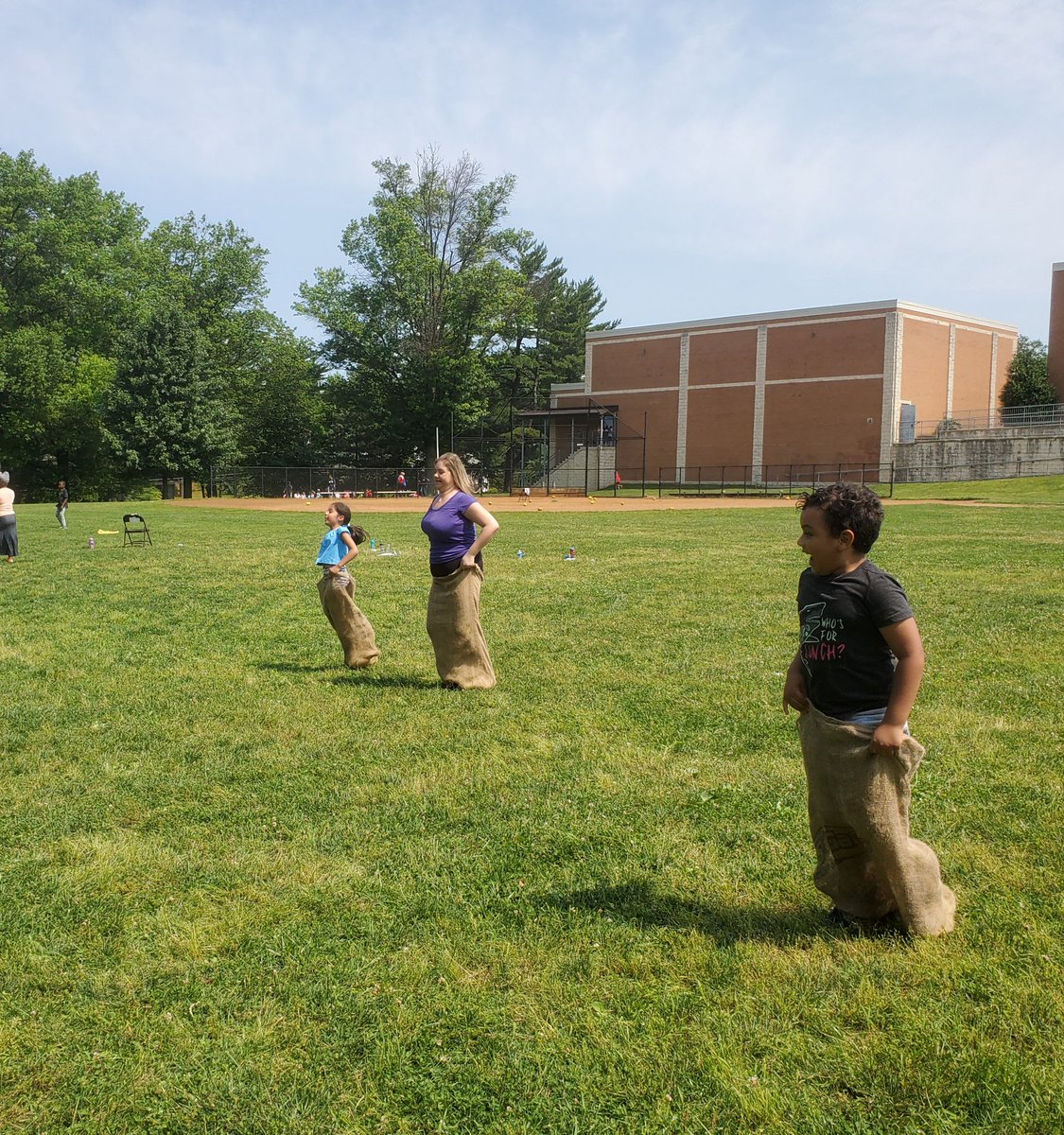 idaredmc's tweet photo. Rosemont teachers hopping in the #potatosackrace give the students some real competition and fun. #FieldDay fun!! @RosemontElem @AP_RosemontElem @angelalynn1982 @MCPS https://t.co/SfBR7oB44k