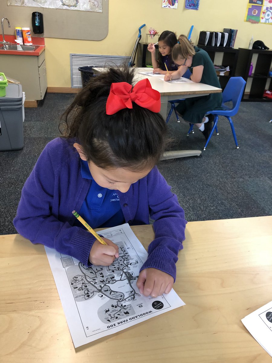 AGCS_01's tweet photo. We are so excited for the zoo! #FirstGrade studies the map and circles all the animals they want to see! @rentonprep @em_chant #Seattle @woodlandparkzoo https://t.co/utGTyBqR5q