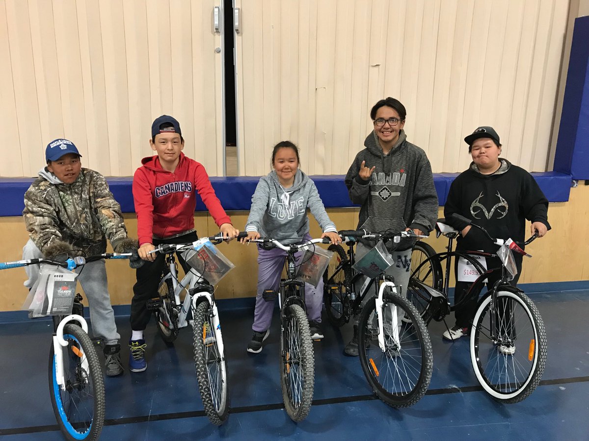 We gave away six bicycles this morning as attendance rewards. Bicycle number six is missing from the photograph