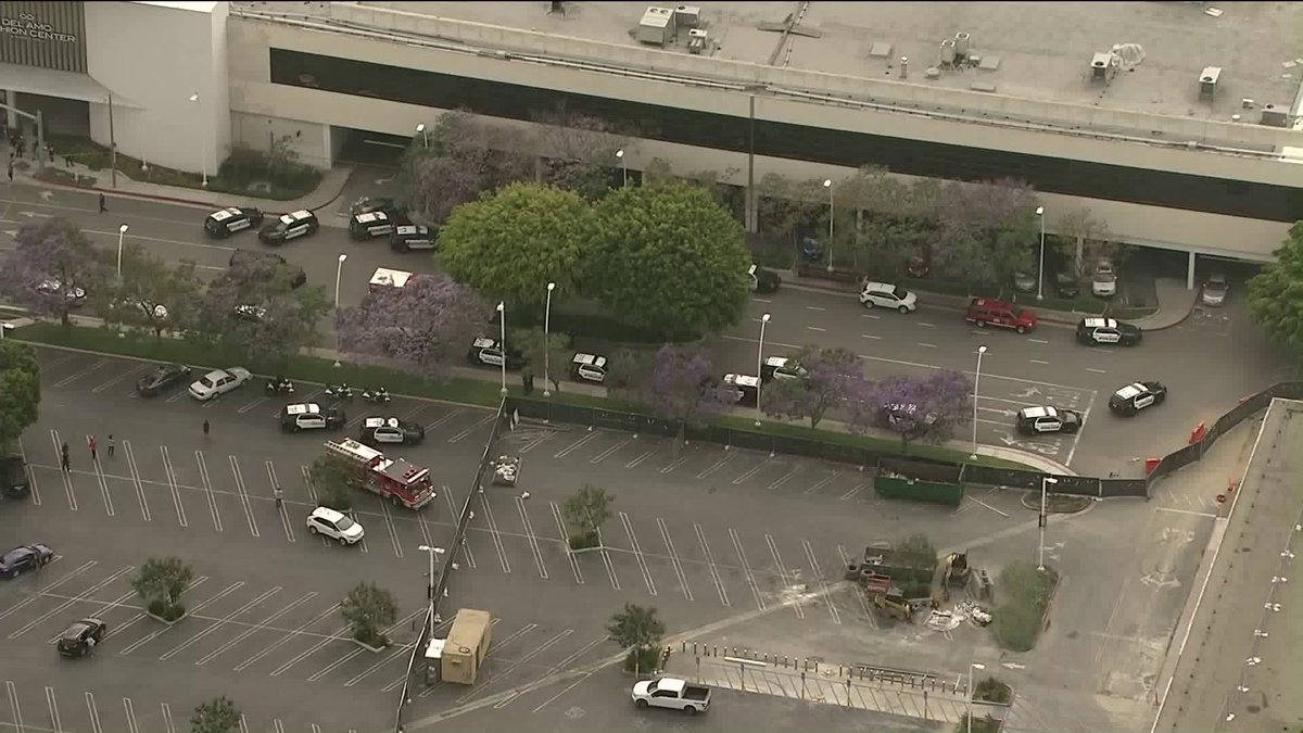 KTLA's tweet photo. More than a dozen @TorrancePD patrol cars are outside the Del Amo Fashion Center in Torrance, and people can be seen leaving underneath crime scene tape. Sky5 is now overhead. https://t.co/C97KXjBxbW https://t.co/dJqtvLRwgv