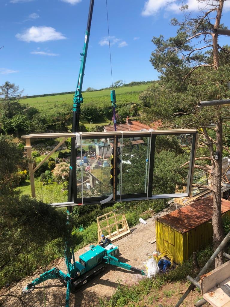 HeyWorker_Ltd's tweet photo. A tricky , but albeit , beautiful location for last weeks install. This impressive house on the hill presented challenges to get the windows into position but the end result was most definitely worth it. #gower #slade #installingconfidence https://t.co/A8yqCVmMrE