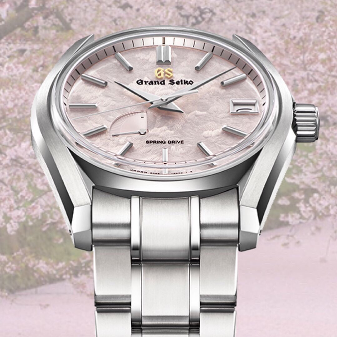 grandseikousa's tweet image. The subtle pink dial of #SBGA413 embodies the graceful Sakura season as cherry blossoms waltz over the water and ground.  Grand Seiko pays tribute to its iconic 62GS – the revolutionary first automatic timepiece launched in 1967. #NatureofTime