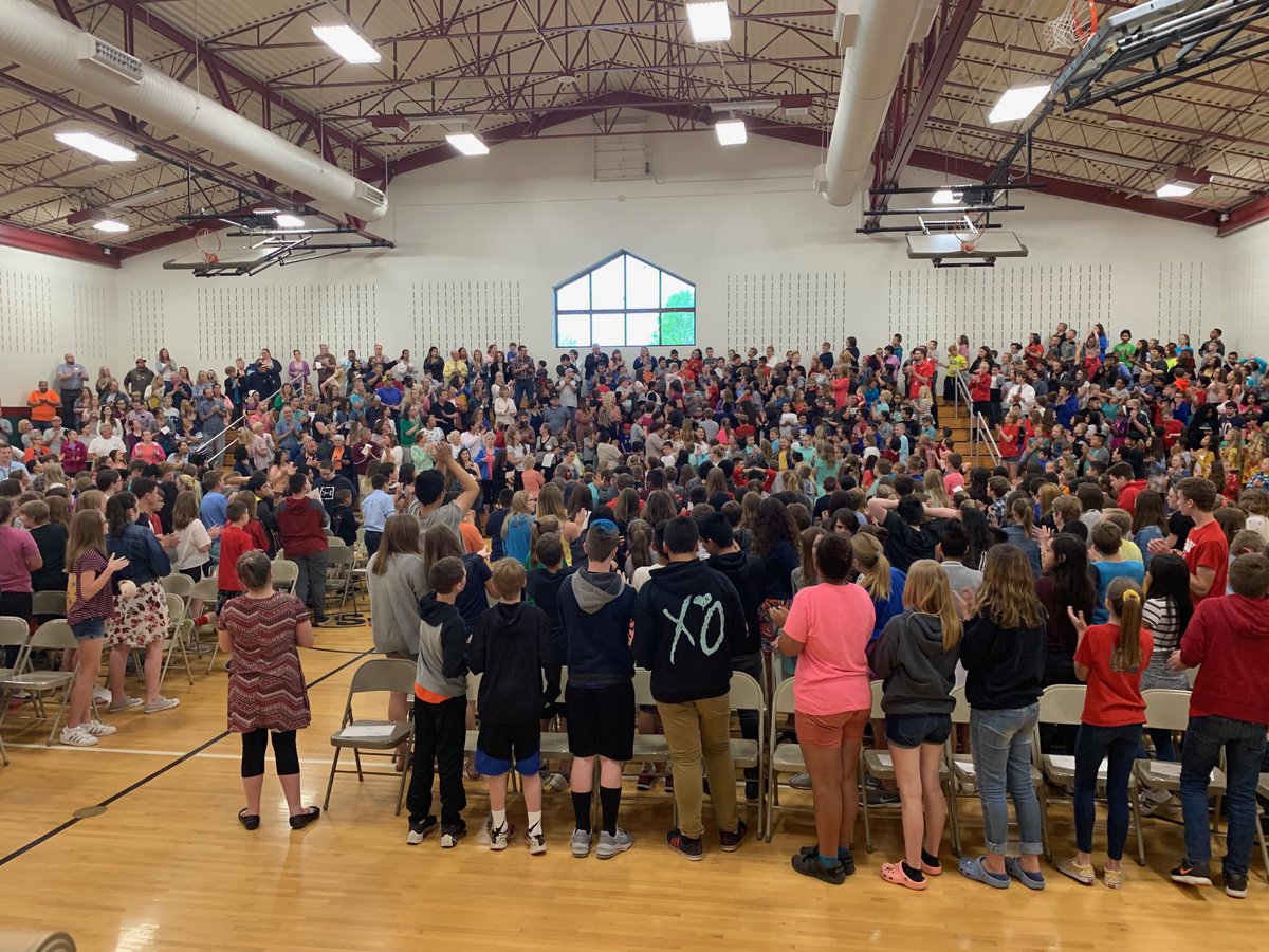 Mrs. Scott receives a standing ovation for her 40 years of service to Riverside and PCSC at the RIS Awards Assembly today. Can you find her in the stands?♥️ <a href="/PlymouthCSC_IN/">PCSC</a>