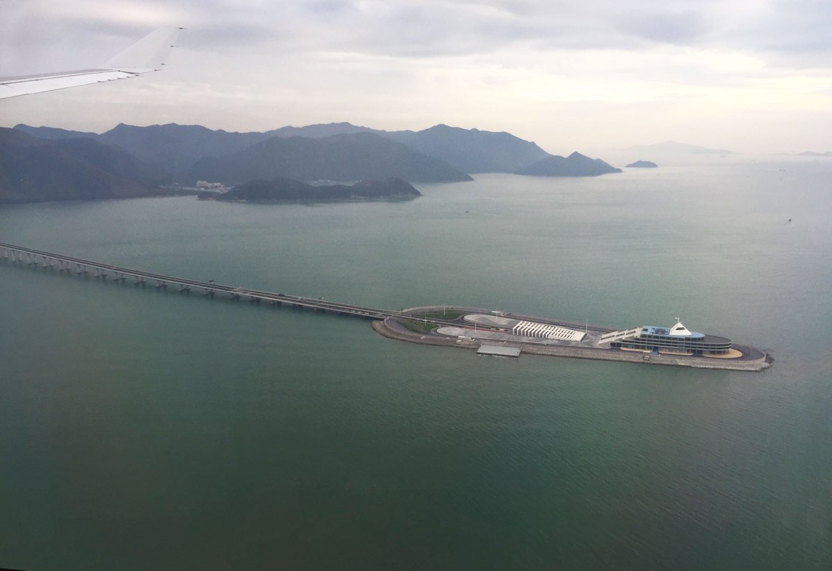 GlobeRovers's tweet photo. Flying low over the Hong Kong–Zhuhai–Macao Bridge, a 55 km(34 mi) bridge–tunnel system. It is the world's longest sea-crossing and longest open-sea fixed link. Here the road goes under the sea. #travel #Bridges #Sealinks #worldsbest #worldrecords https://t.co/VG7Yo8usOj