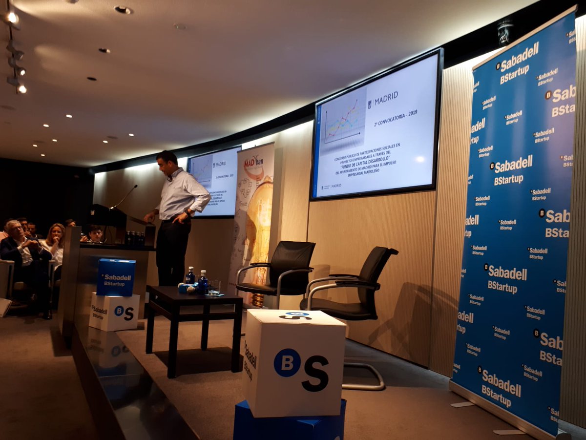 BStartup's tweet photo. .@ElenaGarDguez da la bienvenida al #ForoMADban de @MADban_ES con las claves del programa @BStartup en un repleto Auditorio @BancoSabadell #Madrid. Sigue @ptrucharte, Socio Director en @MADban_ES, presentando el Fondo Capital Desarrollo del Ayto. @MADRID. ¡Arrancamos! https://t.co/tsrvxGo5sz