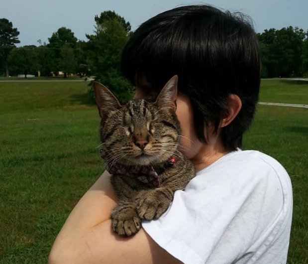 BlindPebbles's tweet photo. Mom is holding me extra tight on this #nationalhugyourcatday. Today, let's embrace those we love and cherish every moment together. I love each one of you more than you know!❤️❤️ https://t.co/wGdWXa7Bw2