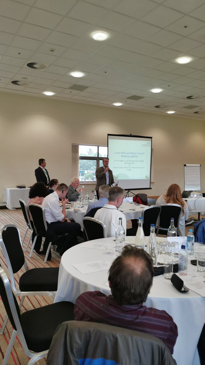 Healthier_Wigan's tweet photo. Dr Tim Dalton, our Chair, and Stuart Cowley, Director of Adult Social Care &amp; Health at @WiganCouncil are talking about how we can work together and with patients to improve GP services #WBCONFERENCE https://t.co/uggjASvyhz