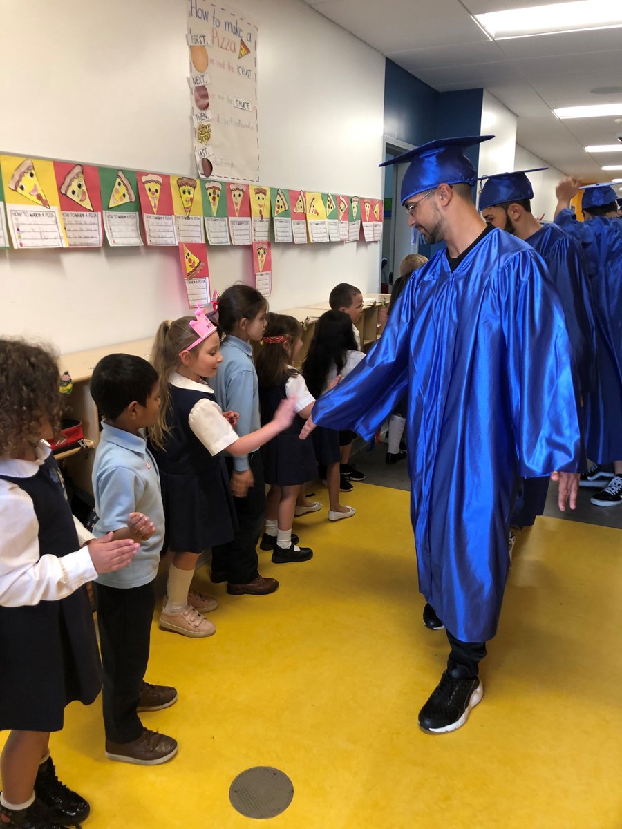 ACS_Tritons's tweet photo. The Class of 2019 got a warm sendoff, complete with cheers and high fives, as they paraded through the halls of Atlantis in their caps and gowns for the last time before graduation on #FallRiverCollegeDay2019. #EdUp https://t.co/W9jK1sd3kF
