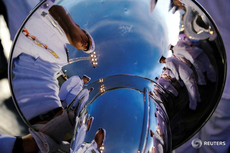 Officials are reflected in a musical instrument as they gather outside the Grand Palace to celebrate the 41st birthday of Thai Queen Suthida in Bangkok. More photos of the day: https://reut.rs/2HV1LLW 📷 @Athit_P