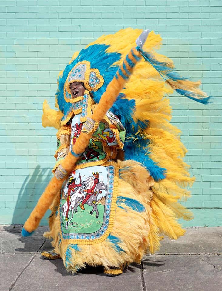 Afro-american from New Orleans Louisiana, partying with ceremonial native indian costumes, wearing your ancestry/heritage/ pictural history, demonstrating the courage/resistance of them