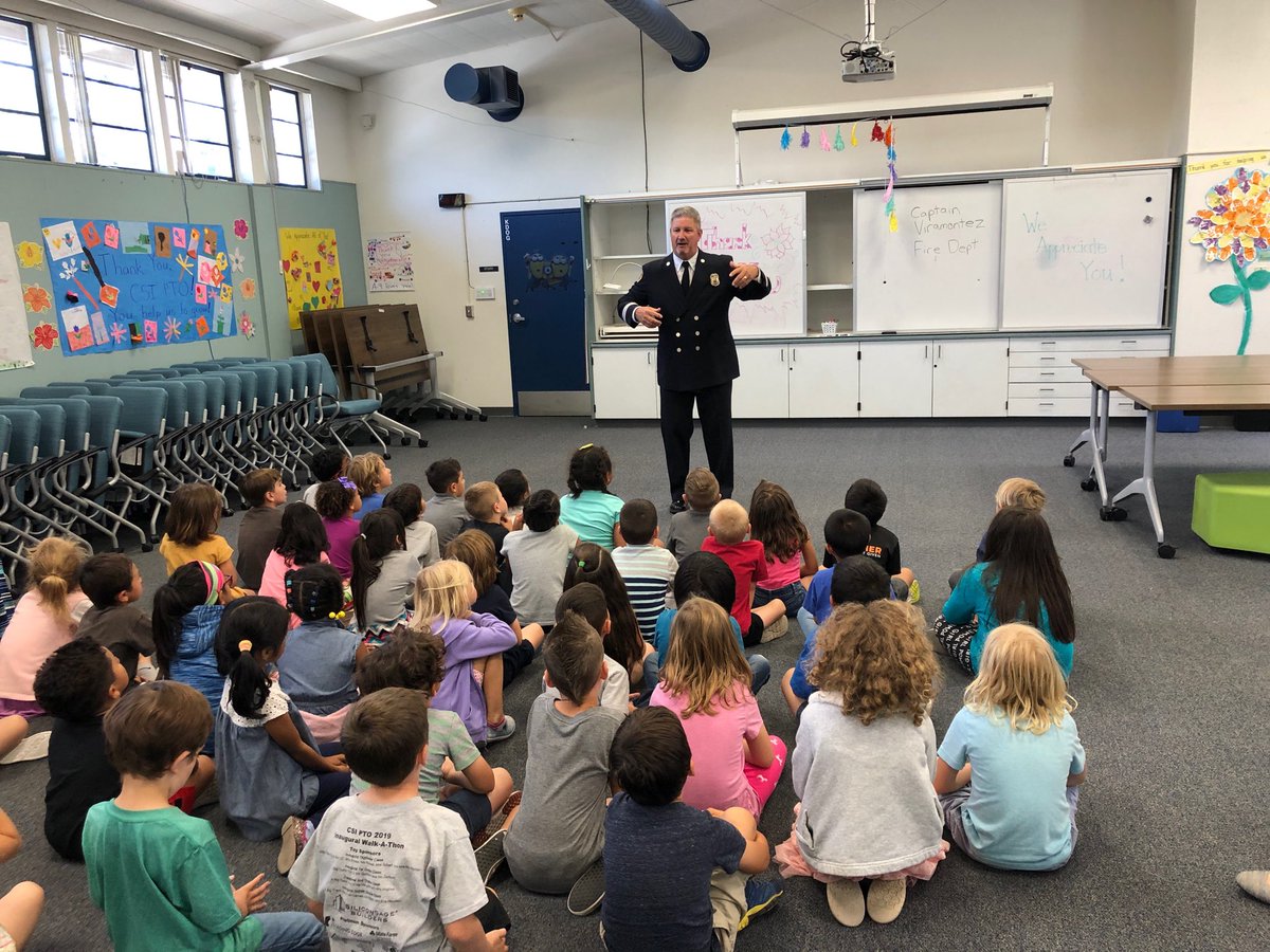 Retired Fire Department Captain, Joe Viramontez, presents safety information to our kindergarteners.