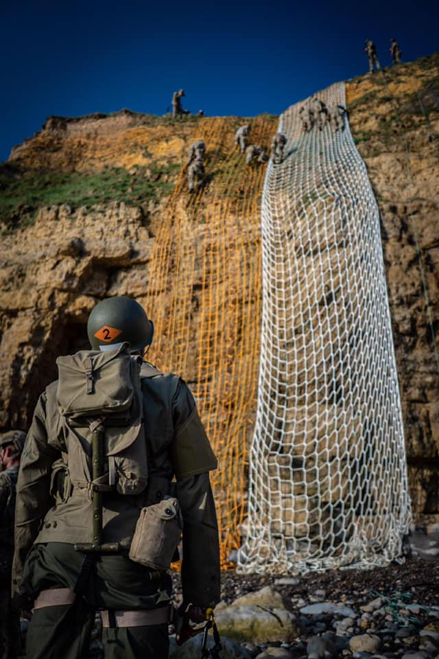 DeptofWar's tweet photo. Following in the footsteps of heroes. @USArmy soldiers climb the historical cliff face at Pointe du Hoc on the northwestern coast of Normandy, France. 75 years ago, soldiers tackled this same cliff and seized the German artillery during the #DDay invasion. #HonorThem #DDay75 https://t.co/oGHmGq1TiL