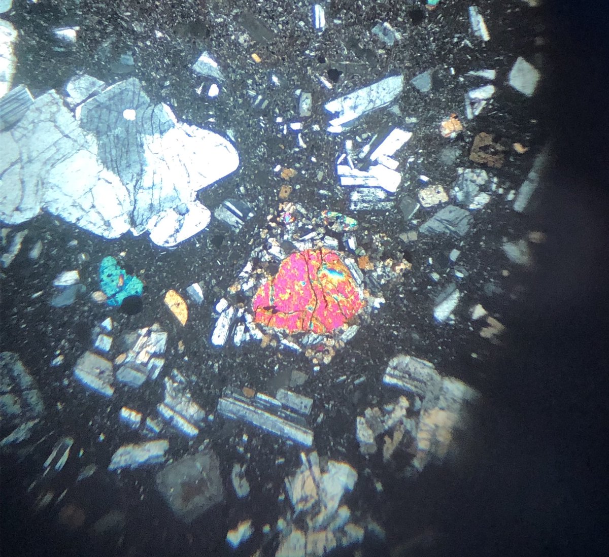 emilyemixon's tweet photo. I know it’s Wednesday (not yet #thinsectionthursday) but I just got my first thin sections for #calbucovolcano and I am so pumped! Basaltic andesite and andesite coming at ya! (Excuse the poor iPhone scope photos). Time to exercise my #igneouspetrology descriptive skills. https://t.co/897oFgTnvp