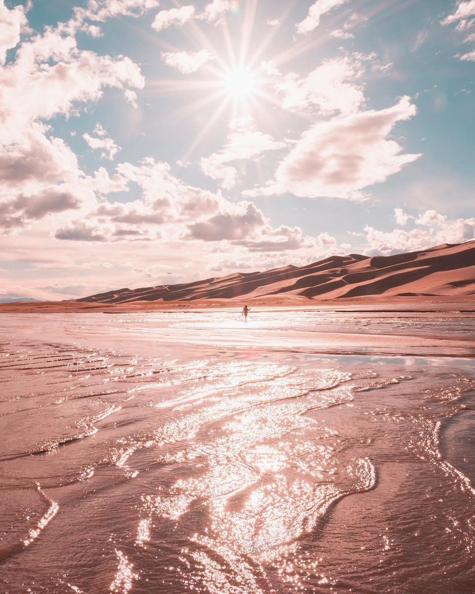 visitalamosa's tweet photo. Medano Creek at the Great Sand Dunes National Park is creating waves this year, literally!  Surge flow is a phenomenon where waves are created by the build up/break down of sand under the creek's flowing water, which is in plentiful supply this year! #VisitAlamosa
📸: @nai_bility https://t.co/6b9RgDtR9A
