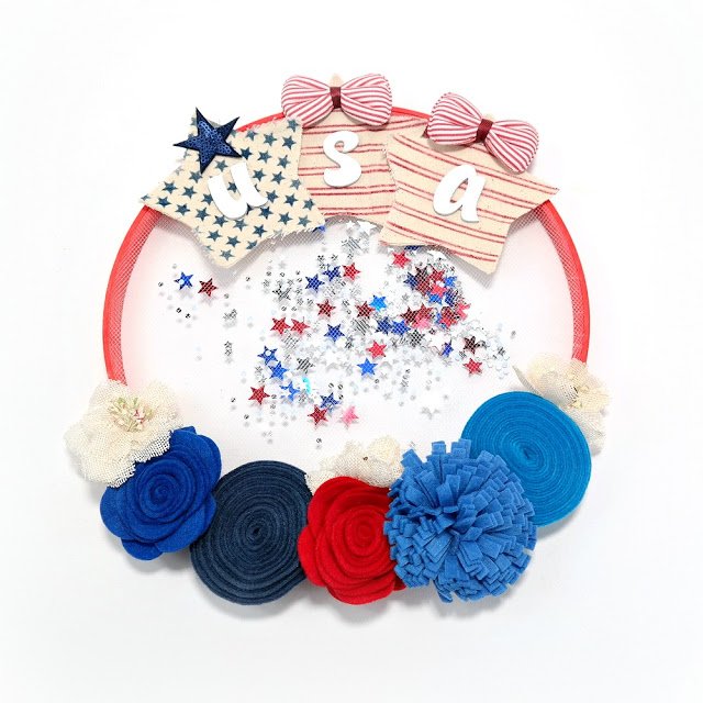 DanaATatar's tweet photo. I used some of my favorite NEW products from @Clearsnap to create this patriotic embroidery hoop shaker wreath. I share the tutorial on my blog. I'd love to have you stop by! #clearsnap #patrioticdecor #redwhiteandblue #4thofJuly #USA #embroideryhoopwreath https://t.co/It2pTGqpWi https://t.co/20vjsXUAAf