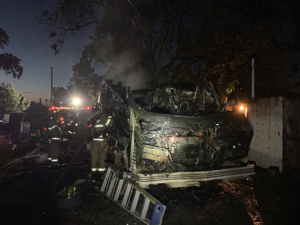 metrofirepio's tweet photo. #MetroFire worked quick to prevent an RV fire from spreading to adjacent structures on #RioLinda this morning on #2ndSt.  No injuries and while cause is unknown the fire spreads to have started in or near the engine compartment. https://t.co/S7oIb3BRGu