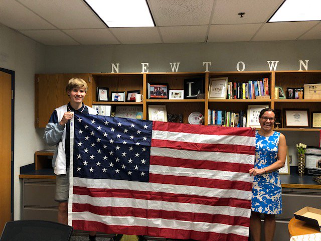 NHS_TWEETS's tweet photo. Principal Dr. Longobucco and Daniel Riber (from Denmark) exchange flags as part of the annual tradition for foreign exchange students attending Newtown High School. #flagexchange #newtownhs https://t.co/msuOOGZXm2