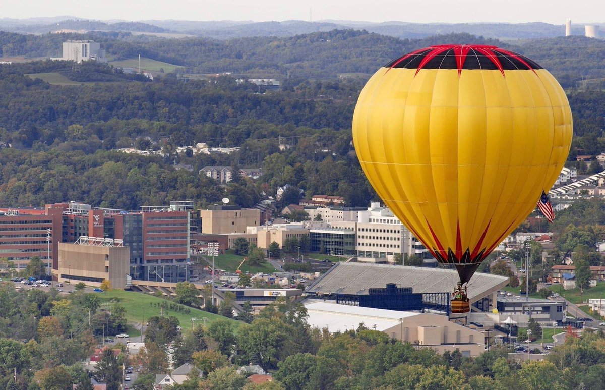 A hot air balloon is pictured flying over Milan Puskar Stadium in Morgantow...