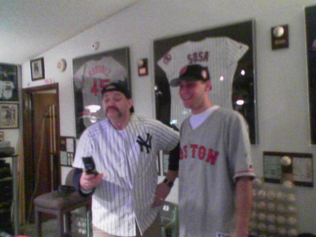 Jimmypisfunny's tweet photo. People have asked for more Rod Beck stories... here we are, after switching jerseys. He grew up a big Dodger fan &amp; HATED the Yankees. So, we made a deal. He wore my Mattingly. I rocked his Pedro Martinez. So, I sort of got to see Rod as Yankee. From a 2006 phone, so a bit blurry. https://t.co/fDyIMB6QbJ