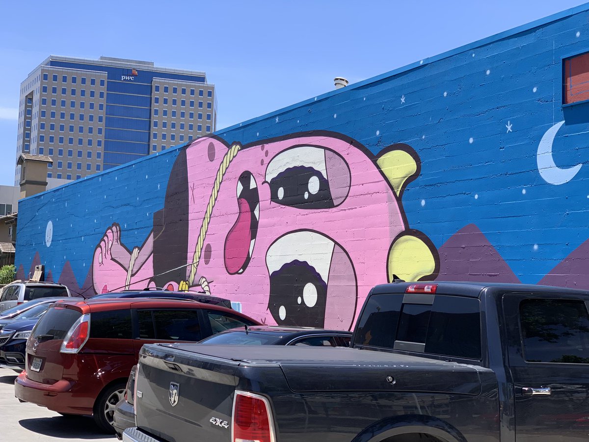 Mural of tied down creature.