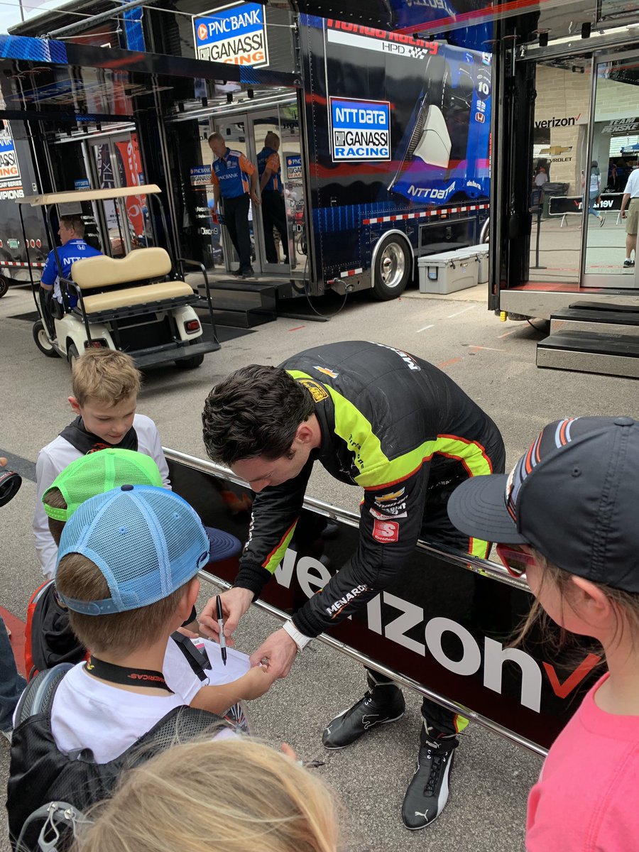 joshnear's tweet photo. @louannebuckley @DXCTechnology @Team_Penske @simonpagenaud @TXMotorSpeedway @IndyCar @COTA Awesome!  She’s really excited to see the guys again, here she (in the pink) is @COTA waiting her turn. He signed her @roadamerica shirt. He was so good to the kids and really took some time with them. https://t.co/Cc7TBip7zi