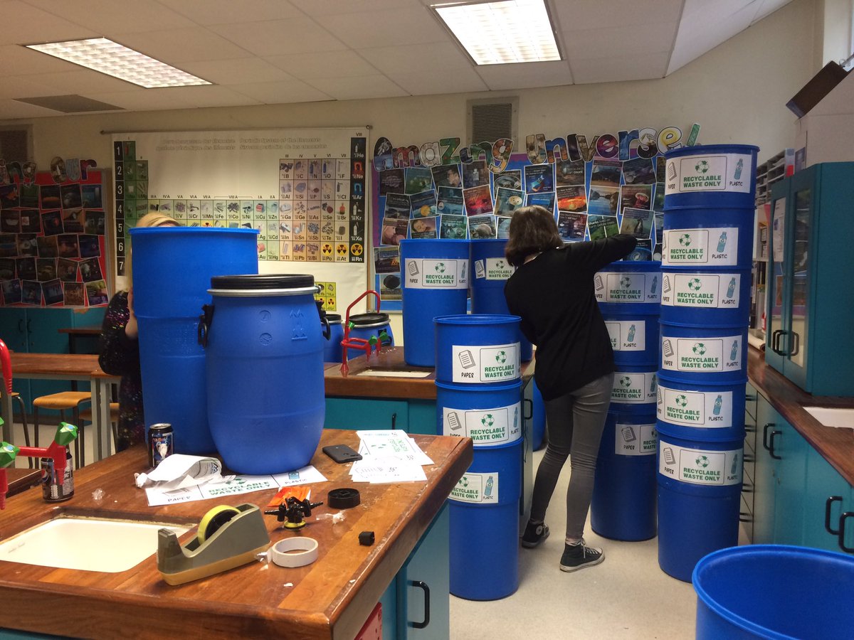 NewryHigh_Sci's tweet photo. Ciara, Jessica and Emilis; three of our wonderful year 11 students are working hard on their day off of exams to recycle some old drums donated by Almac and turn them into recycling bins for the school! What incredible role models ✨ https://t.co/mQTTruoWMN