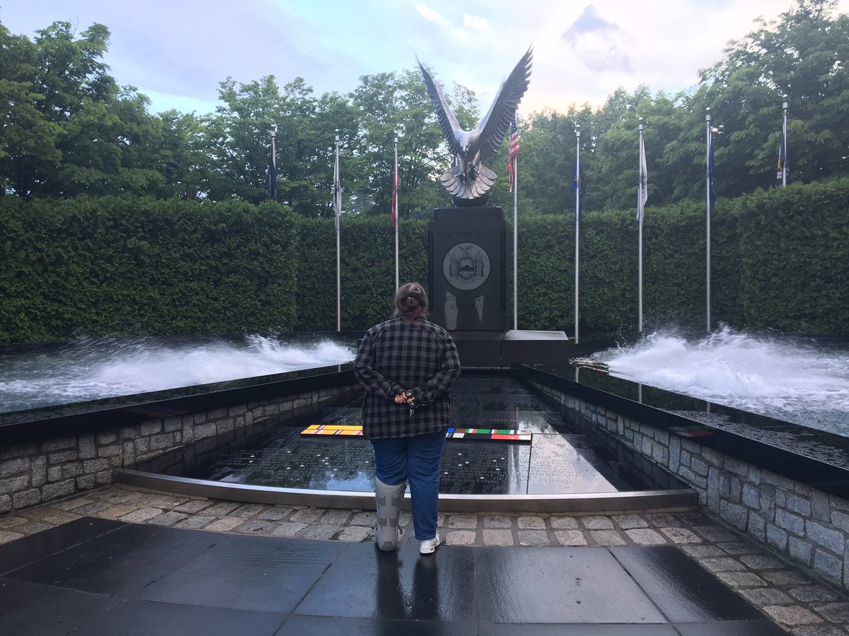 JRCJMU's tweet photo. A woman who works in the #CorningTower for @HealthNYGov pauses this morning at NYS WWII Memorial #DDay75thAnniversary. Her father was wounded in WWII and came home deaf. @WNYT https://t.co/BRx2qpbRsI