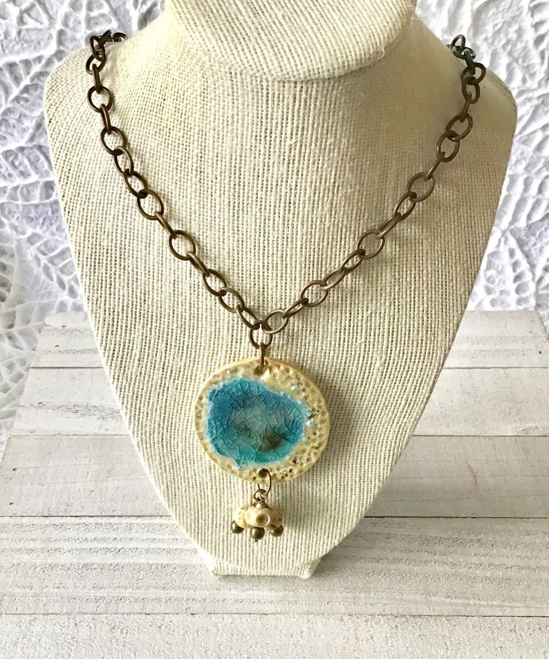 “I create ceramic jewelry infused with melted glass. Oftentimes my pieces are confused with gemstones or crystalline quartz found in nature. They are one-of-a-kind.” -Susan Mahoney 
Come see her work at the Worthington Arts Fest June 15+16!
#asseenincolumbus #artmakescbus