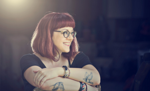 Portrait shot of writer Victoria Schwab with folded arms. Image by Jenna Maurice