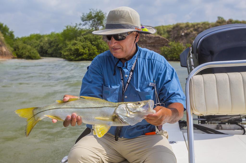 LeftyRay's tweet image. Check out this photo of mine in the June issue of the Texas Parks &amp;amp;Wildlife magazine. This is Mark Mchado holding a snook caught in the Brownsville Ship Channel. #fishgloomis #flyfishing #texascoast #snook