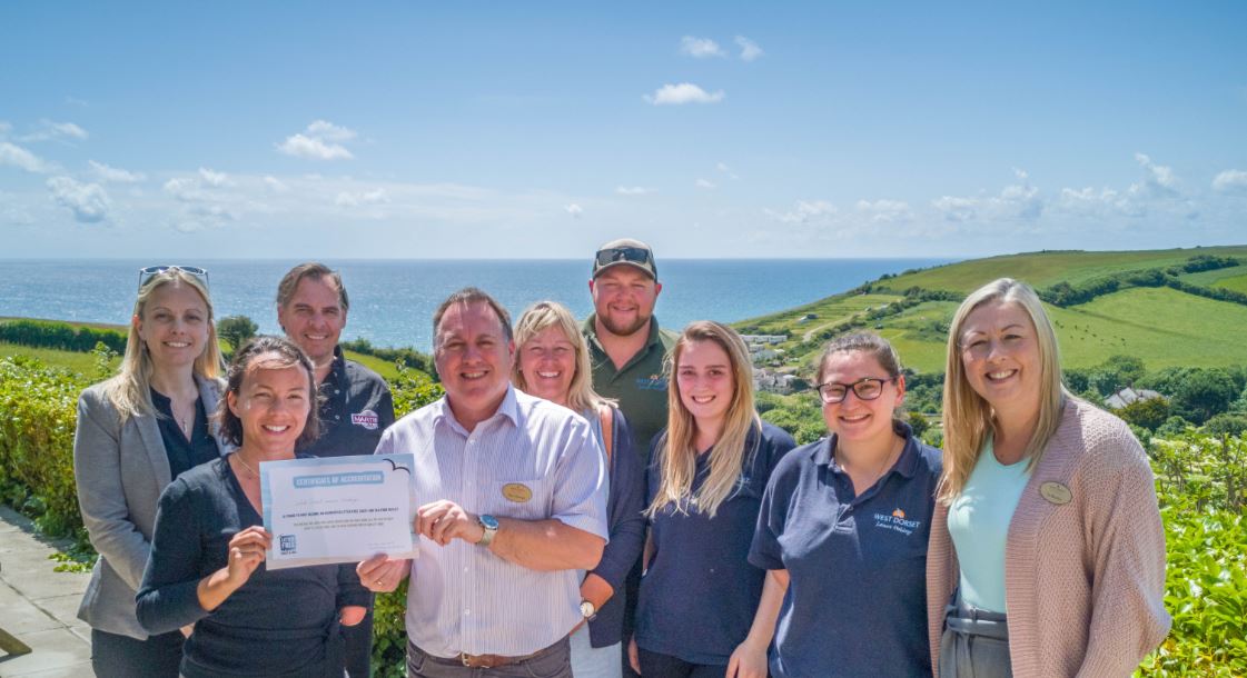 WDLH's tweet photo. The team at Highlands End Holiday Park were delighted today to be presented with an award from Litter Free Coast and Sea for helping to create a cleaner, greener environment, with litter free beaches and water. 
@LitterFreeCoast  #Dorset #WorldEnvironmentDay #KeepDorsetClean https://t.co/waUKjCaAKf