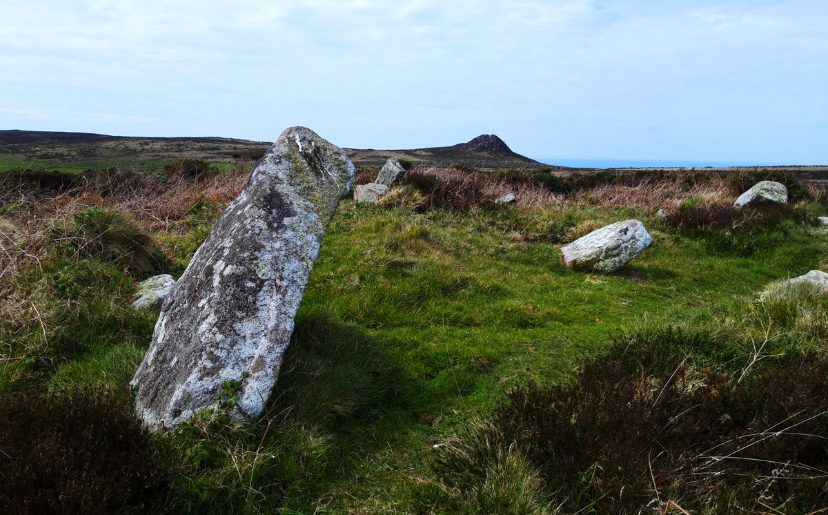 Boskednan MenhirA short walk along the path from Boskednan Stone Circle is this odd triangular stone pointing towards Carn Galver outcrop on the horizon. Part of a burial mound? Roofstone from a tomb? Or a standing stone in its own right?  #PrehistoryOfPenwith