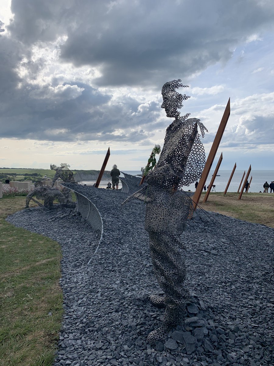 James1940's tweet photo. This DDay 75 Garden by John Everiss at Arromanches really is beautiful and incredibly moving.  Here, the veteran looks across at the fading memory of his younger self.  Profound, thought-provoking and rather sad too. #DDay75 https://t.co/ZK64Upvr07