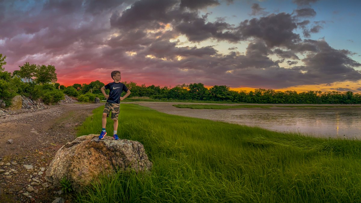 Some stories don't need words. Like seeing a 7-year old boy standing on a rock like he owns the world. #kingofthemountain #storytelling #businessstorytelling #beachstory #beach #beachlife #beachwear #Clouds