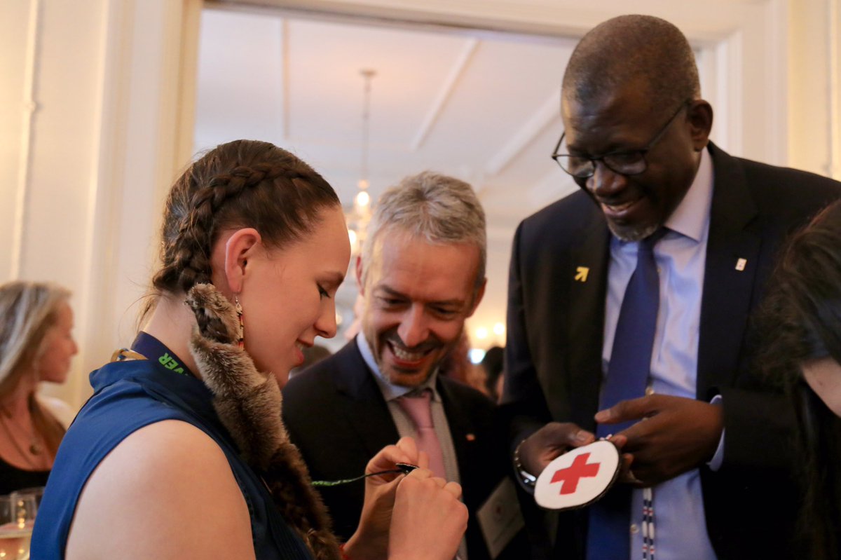 redcrosscanada's tweet photo. We ❤️ this @WomenDeliver moment! @As_SyIFRC Sec. Gen of @IFRC, overjoyed with a handmade medallion from our Indigenous Youth Leader, Shaylynn McAuley. #RedCrossWD https://t.co/3Fprl0xjcx