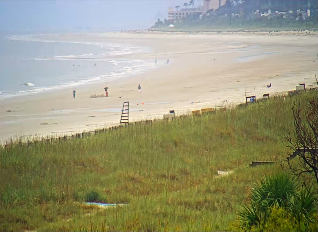 HiltonHeadLife's tweet photo. A little rain on Hilton Head this afternoon. Here's a zoomed in picture of Folly Beach - Check here for the live webcam: https://t.co/uUAOxYraVi  - #hhi #hiltonhead https://t.co/jDSG7ajlqp