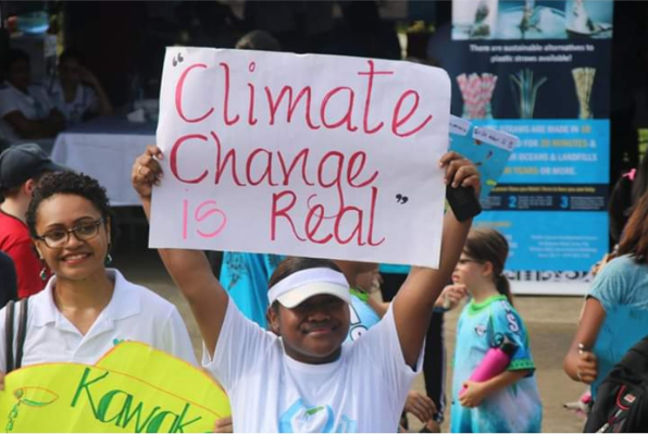 WiFN_Fiji's tweet photo. Our lovely Lusi Dulunaqio with her poster for the #WorldOceansDay march.

#climatechange is no joke!

#TogetherWeCan
#TeamWiFN

@ForumSEC @IUCN_Oceania @spc_cps @uspmarine1 https://t.co/o8jEoZ2pLY