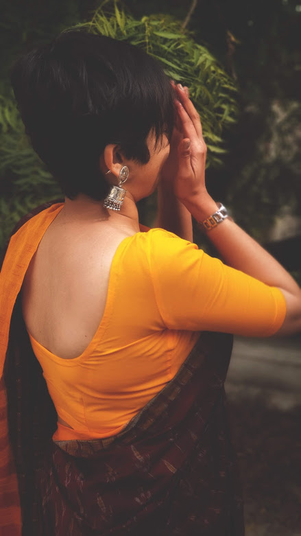 We spent the entire day having a gala time. Post the Puja ending, I invited her to my place to watch Antaheen, a movie she hadn't watched yet, which we were discussing at the Puja.She asked me to click a couple of photos of hers in saree to send to her mum and I obliged.