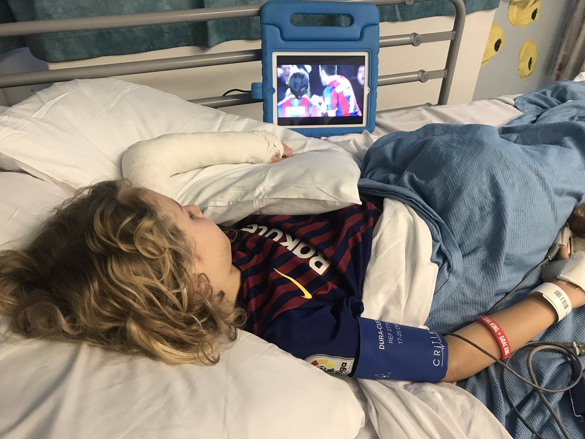 Just out of surgery and watching his team <a href="/FCBarcelona/">FC Barcelona</a> <a href="/TeamMessi/">Team Messi</a> to take away the pain! Can’t wait to visit Nou Camp in October! #braveboy