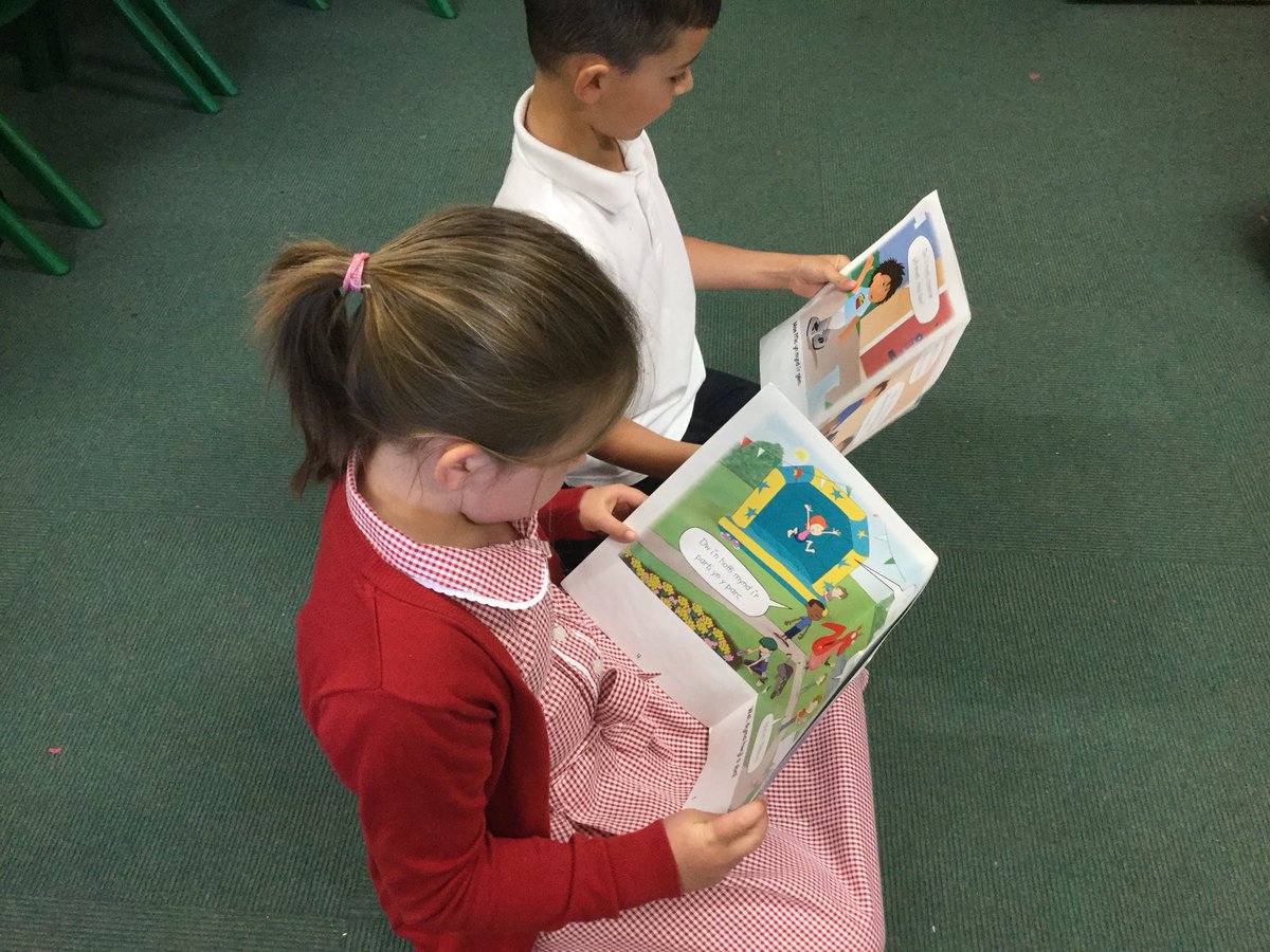 Yr1GUPS's tweet photo. Children in Class1C have enjoyed reading Welsh books this week. They love Fflic and Fflac and enjoy taking it in turns to take them home.@Yr1GUPS  #GUPSCym https://t.co/YKB8FTGZgW