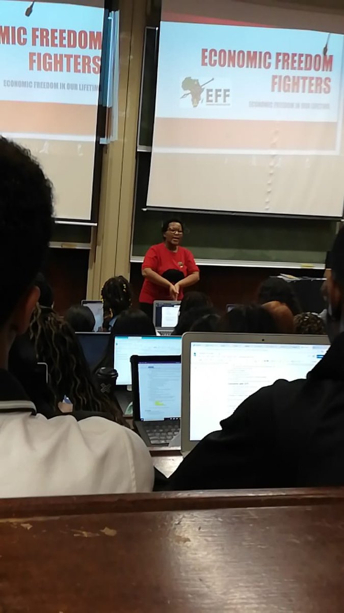 EFFWesternCape_'s tweet photo. Provincial Spokesperson, Ftr Phiwaba Madokwe giving a presentation on the EFF, its policies &amp; its role in post-democratic SA to University of Texas students at the University of Cape Town this afternoon.

#EFFIsASchool #EFFRedFriday

@EFFSouthAfrica @GardeeGodrich @MelikhayaXego https://t.co/63rapwMxNF
