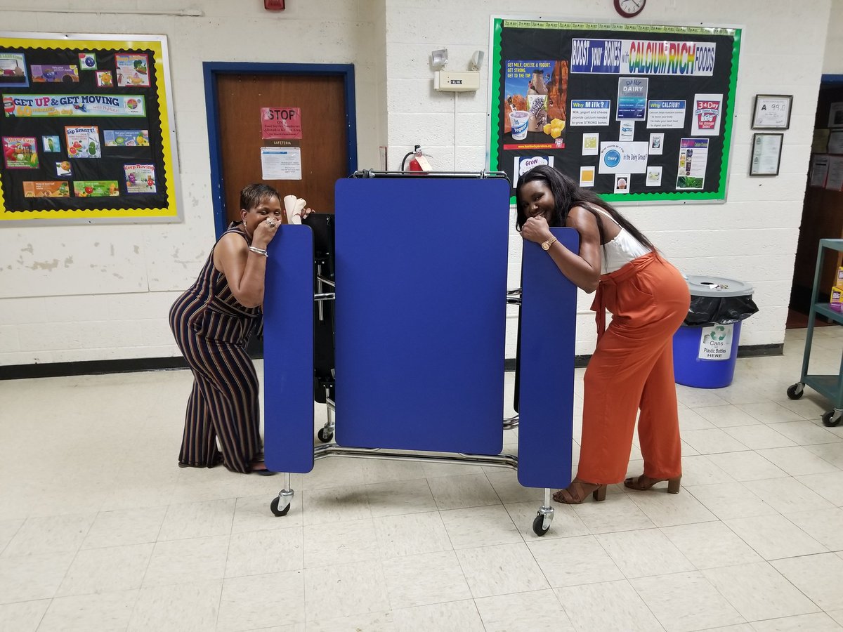 Mrs. Burwell and Mrs. Green work to prepare for our students after our Fifth Grade Recognition Program.