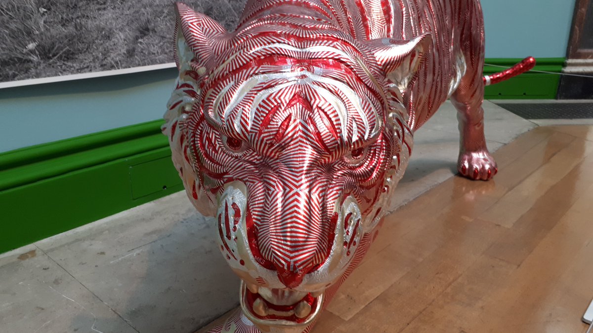 To those of us who obsessively flatten out and fold the foil wrappers of choccie biscuits, sculptor David Mach is now our God. Here's his 'Easy Tiger' in the RA Summer Show. Tunnock's wrappers used like silver leaf