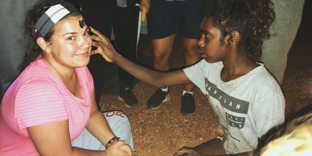 Saint Mary's Student abroad in Australia, being face painted by a local. 